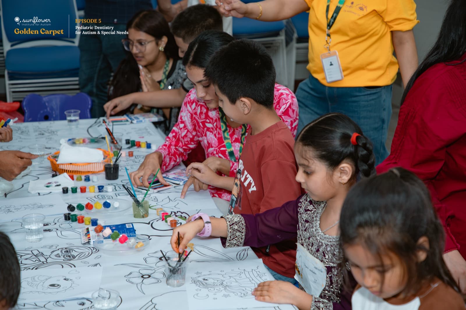 Children painting together during a community activity